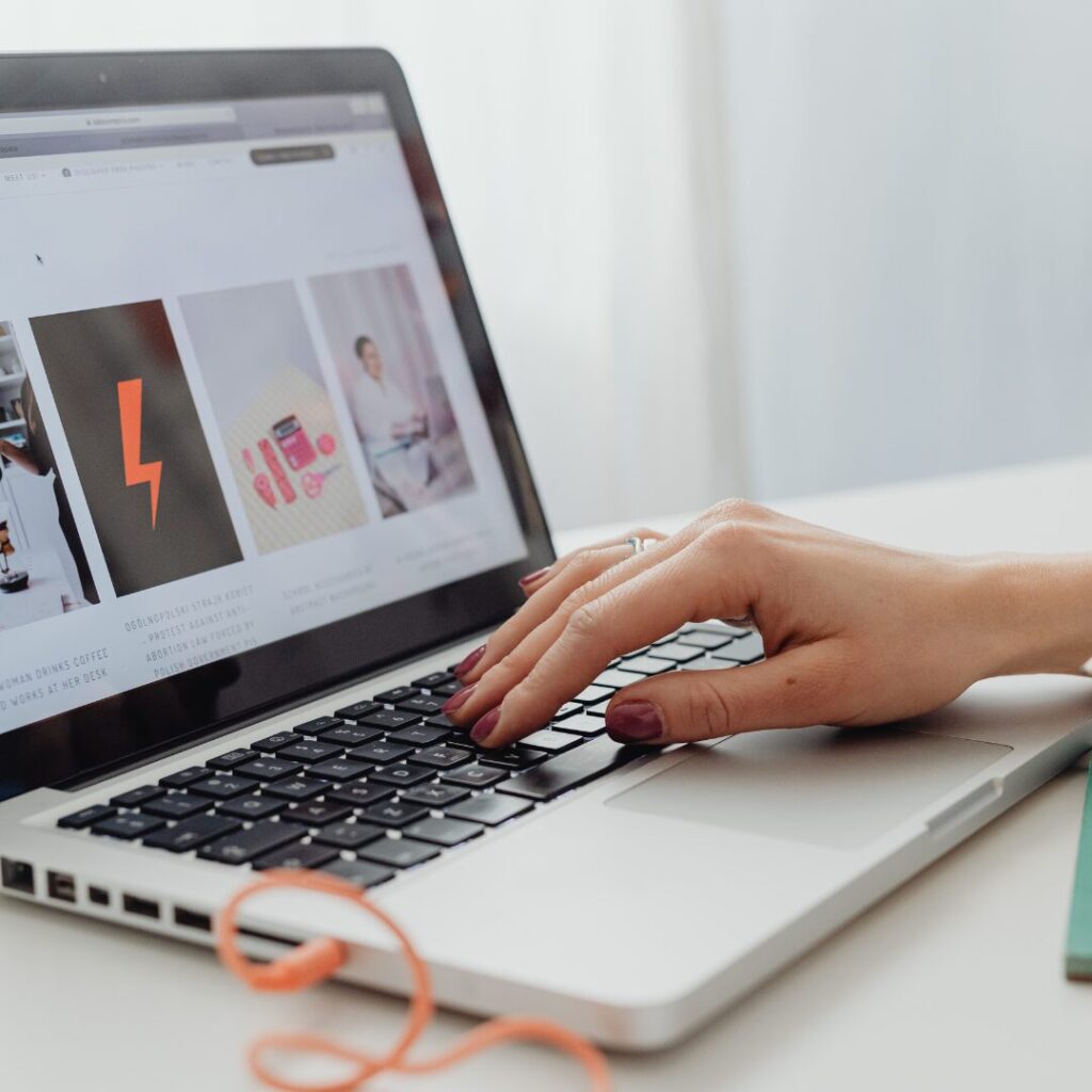 Photo of a laptop on a desk with a website launch on the screen.